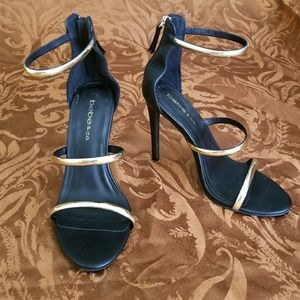 bebe Black and Gold Strappy Heels